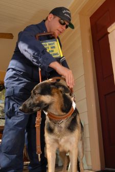 Auxiliarist Davis and his guide dog Payton